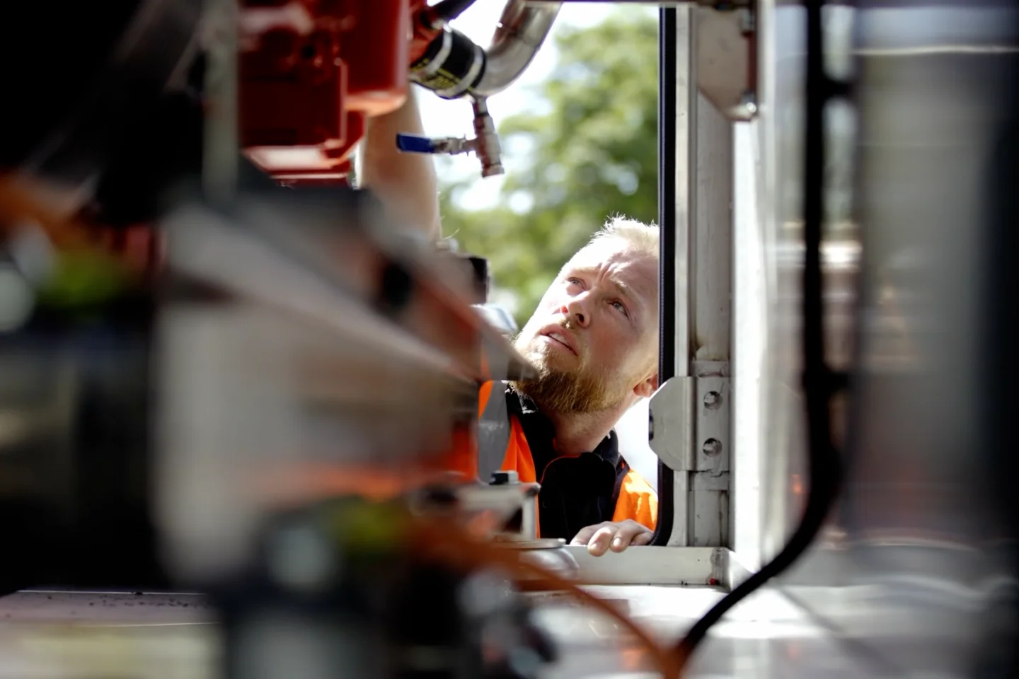 A field engineer inspects the working of a generator